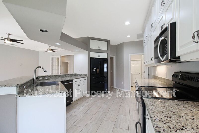 Annual rental: Spacious 3BR/2BA Creekwood Home with Office, Screened Lanai, EV Charger & Resort-Style Amenities property image