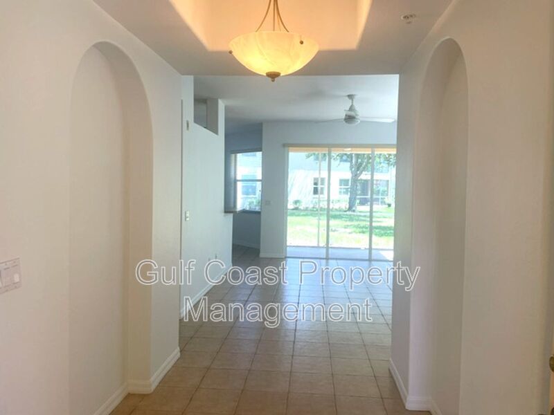 Elegant 3 Bedroom End-Unit Condo with Screened Lanai & Pond Views and A Private Garage property image