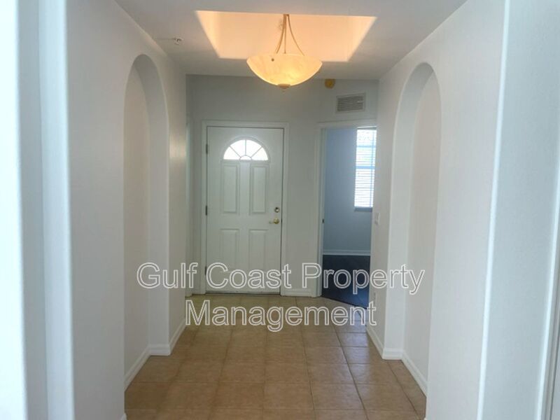 Elegant 3 Bedroom End-Unit Condo with Screened Lanai & Pond Views and A Private Garage property image