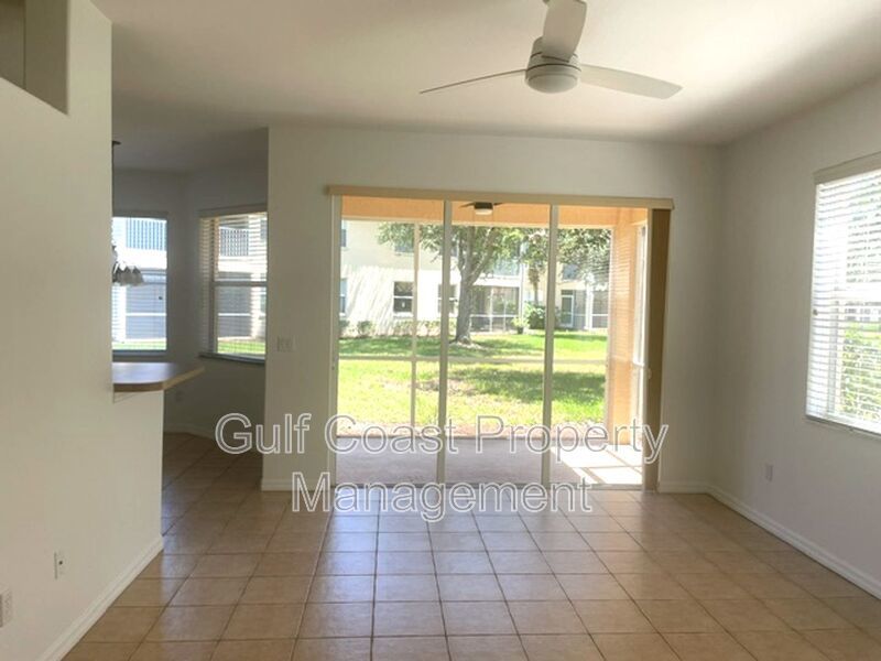 Elegant 3 Bedroom End-Unit Condo with Screened Lanai & Pond Views and A Private Garage property image