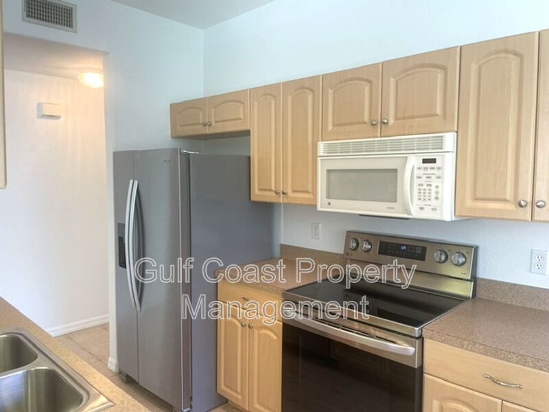 Elegant 3 Bedroom End-Unit Condo with Screened Lanai & Pond Views and A Private Garage property image