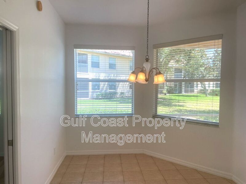 Elegant 3 Bedroom End-Unit Condo with Screened Lanai & Pond Views and A Private Garage property image