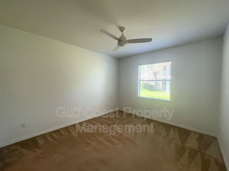 Elegant 3 Bedroom End-Unit Condo with Screened Lanai & Pond Views and A Private Garage property image