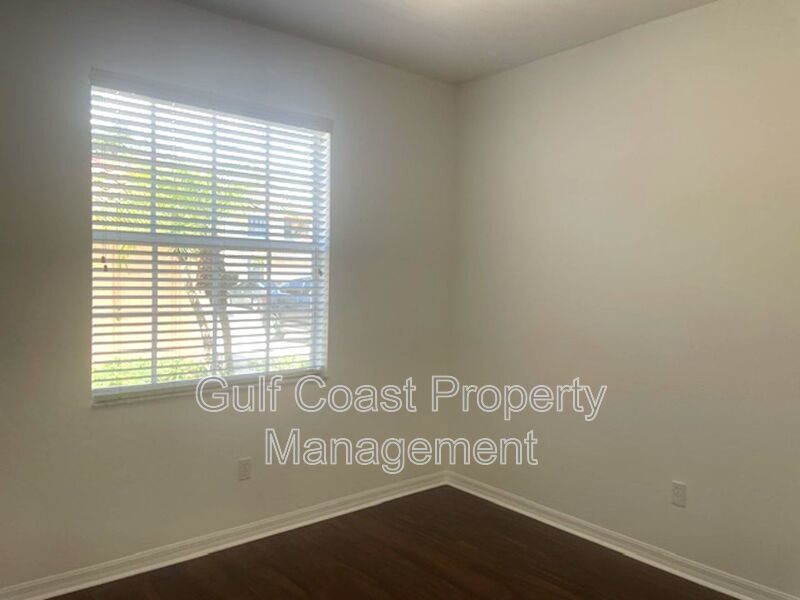 Elegant 3 Bedroom End-Unit Condo with Screened Lanai & Pond Views and A Private Garage property image