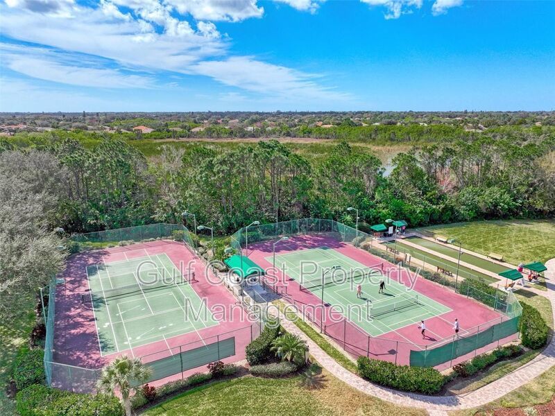 Elegant 3 Bedroom End-Unit Condo with Screened Lanai & Pond Views and A Private Garage property image