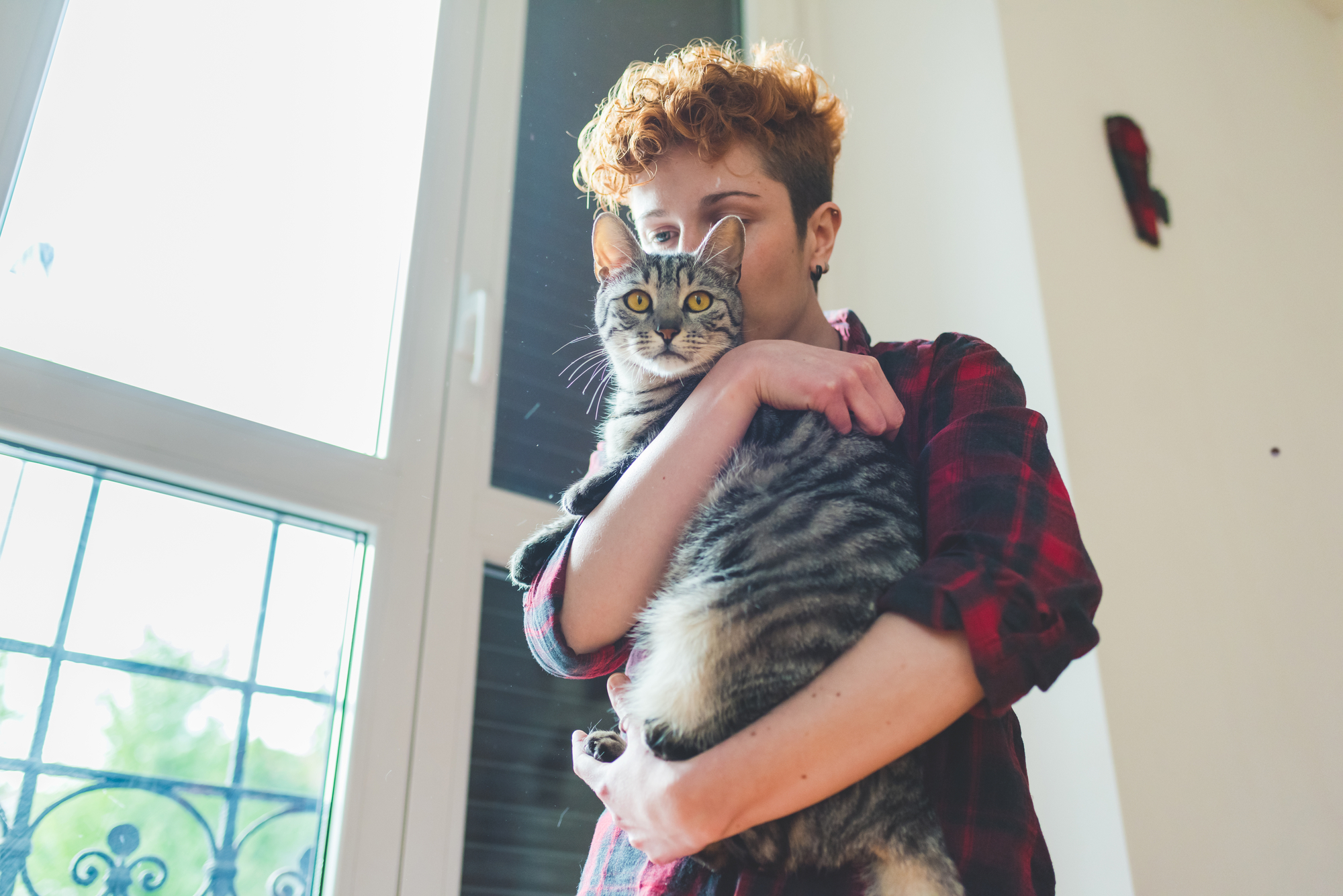 Woman and cat in house