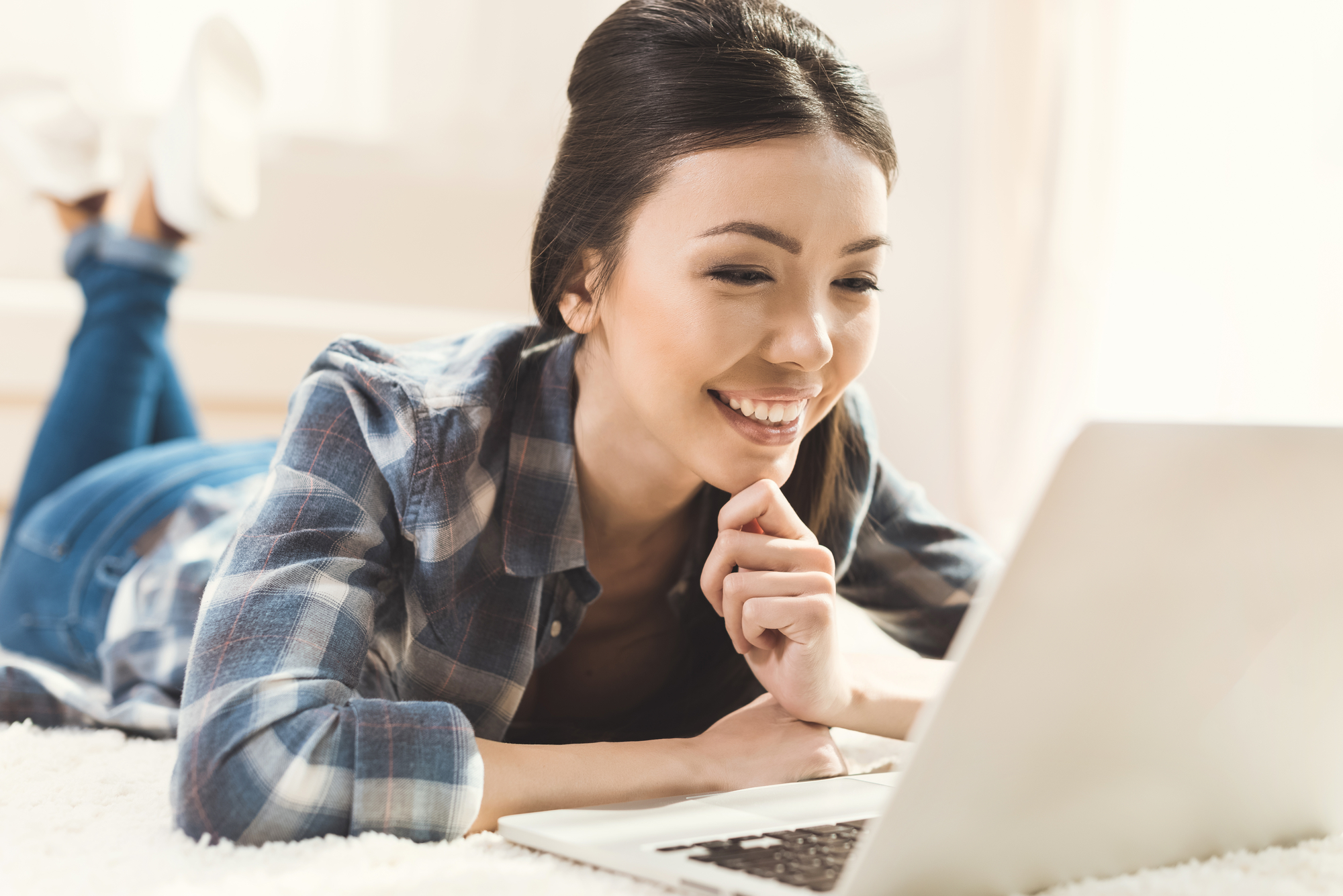 Woman looking at laptop monitor